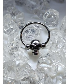 Piercing anneau captif avec tête de mort perlée teton poitrine